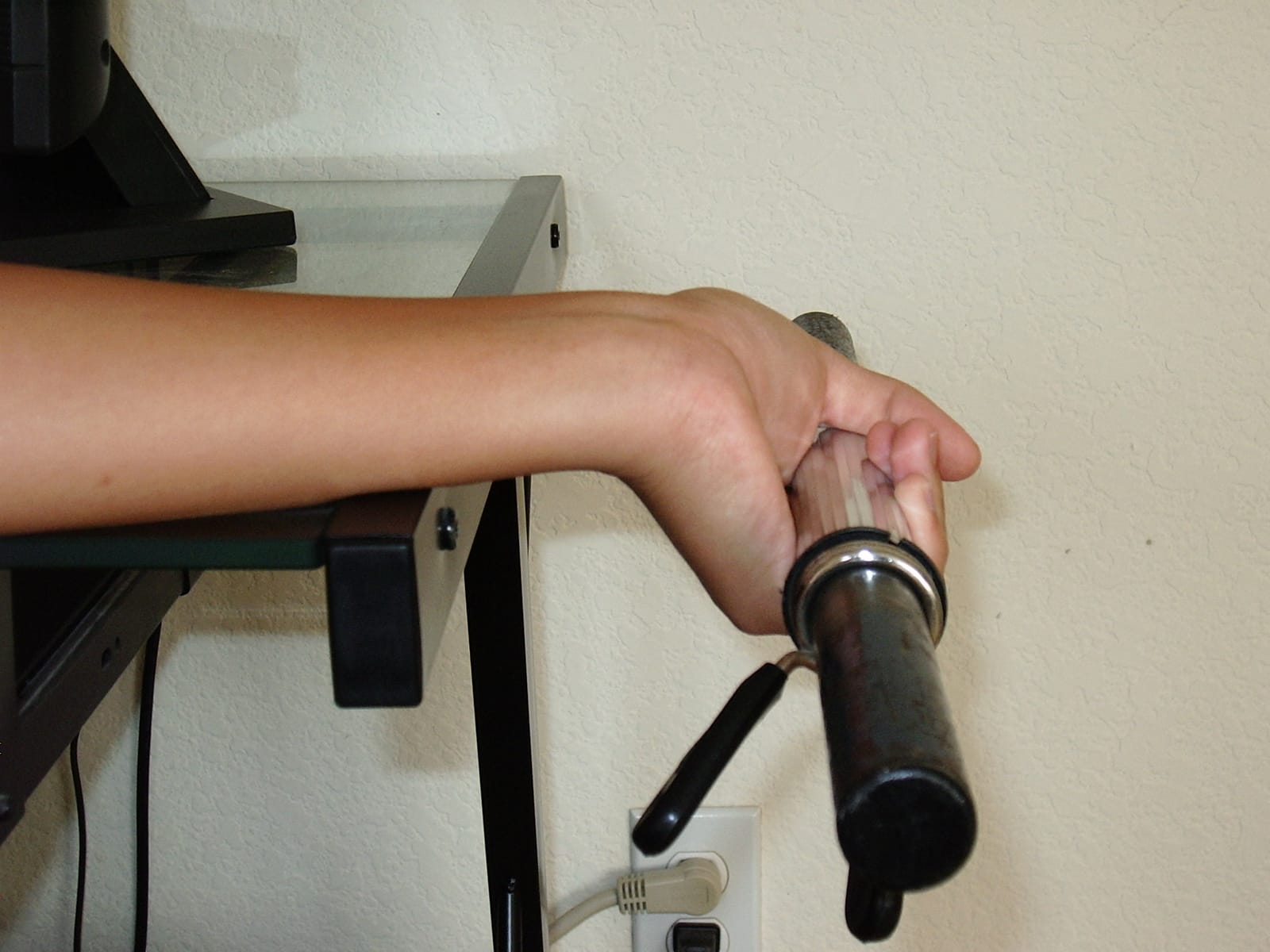 Supported dumbbell wrist curl at the stretch.